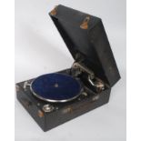 A black vinyl ebonised wooden cased portable front winding picnic gramophone by Columbia