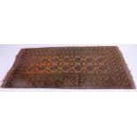 An Islamic handwoven Persian rug having geometric borders with multiple  medallion motifs to the