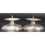 A pair of mid century WMF stamped silver plated candlesticks of stub form having prickers to centre.