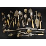 A large collection of flatwares to include berry spoons, stilton trowels, cheese knives,