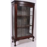 An excellent 1920's mahogany bow front leaded glass display cabinet of upright form with bow glass