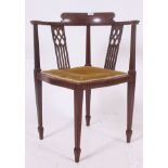 An Edwardian Mahogany inlaid corner chair.
