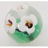 A Langham glass paperweight with white l