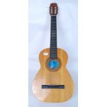 A Spanish six string acoustic guitar wit