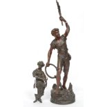 Two cast metal figures, man with raised