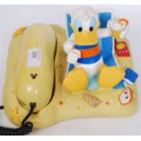 A retro novelty telephone of Donald Duck