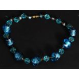 A vintage Bohemian turquoise and foil set glass bead necklace.