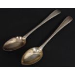 A pair of silver hallmarked Georgian table spoons by Samuel Godbehere, Edward Wigan & James Boult.