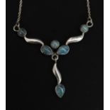 A ladies silver necklace with teardrop multiple pendant drops inset with agate stones.