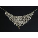 A 1970's Indian silver white metal vintage retro v-shaped multiple string silver white metal