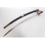 An Indian cowbow sword complete with leather scabbard.