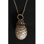 A stunning silver and white metal pineapple pendant and necklace.