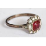 A silver and ruby garnet stone ladies dress ring.