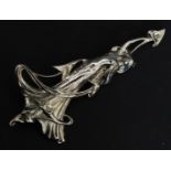 A high Art Nouveau style ladies fairy brooch of white metal form complete with pin to verso.