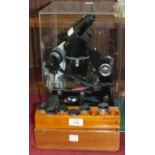 A Cooke Troughton & Simms Ltd black-lacquered binocular microscope M601789, with four spare lenses