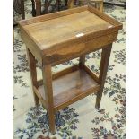 A small walnut table, the rectangular tray top fitted with a frieze drawer, on square tapering