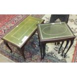 A nest of three modern stained wood tables, each with leather insets and plate glass tops, 50cm wide