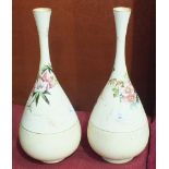 A pair of Doulton Burslem ovoid vases with tapering slender necks and floral decoration, factory