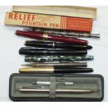 A 9ct-gold-covered fountain pen (damaged), other vintage pens, a pair of writing box inkwells and