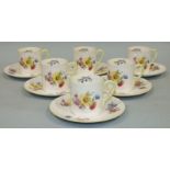 Six each Shelly coffee cans and saucers decorated with flowers on a white ground, pattern no. X2348,