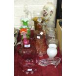 A cranberry glass jug with clear glass handle, 14cm high, a similar bowl and other coloured and