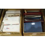 An accumulation of Great British first day covers in nine albums and loose contained in two boxes,