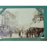 An album of approximately 300 postcards, RPs, including a Redruth street scene, WWI embroidered