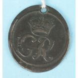 A George II oval brass token for the King's Road Chelsea, crowned G.R. monogram, dated 1737, 'THE