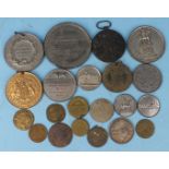 A collection of tokens and medallions, including an Ashby & Young Stockbrokers token, a George III