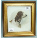 An early-20th century ceramic plaque painted with the head and shoulder of a forlorn hound, 17 x