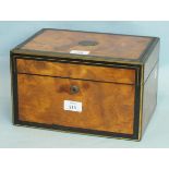 A Victorian walnut jewellery box inlaid with ebony and brass, the hinged lid revealing a fitted