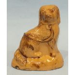 A Staffordshire press-moulded seated Spaniel.