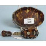 A small tortoiseshell pin tray of oval form, with silver wavy rim, 12cm long, London 1891 and a