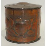 A Newlyn copper tobacco pot and cover of cylinder shape embossed with apples, 11cm diameter, 10cm