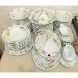 Approximately sixty pieces of Limoges floral-decorated dinner ware, (some a/f).