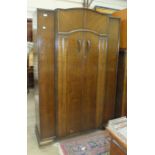 A mid-20th century oak bedroom suite comprising a double wardrobe 120cm wide, a tallboy and a