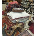 A collection of Middle Eastern rug and textile-covered cushions and four late-20th century wooden