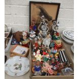 A collection of various ceramic and composite clown ornaments.
