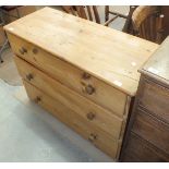 A 19th century pine chest of three drawers, 110cm wide, 77cm high.