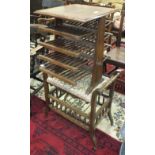 A brass inlaid hardwood magazine table/stand and an upholstered seat adjustable piano stool, (2).