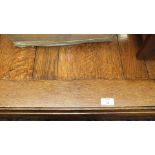 A large oak rectangular dining or library table on plain square legs, 122 x 215cm and a narrow