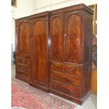 A large Victorian mahogany breakfront wardrobe, the plain cornice above a pair of full length