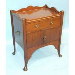 A Georgian-style mahogany tray-top commode having a drawer and a pair of cupboard doors, on turned