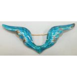 Child & Child, an enamelled wing brooch with blue and green enamel, unmarked, 10cm wide, 28g, in