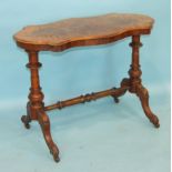 A Victorian inlaid walnut centre table, the quarter-veneer serpentine top on turned end-supports and