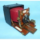 A 19th century Sanderson quarter-plate camera, the mahogany front and base with Aldis Anastigmat F/6