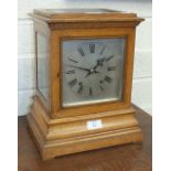 A 19th century oak mantel clock of plain rectangular form, having a silvered dial and German gong-