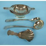 A Victorian shell-shaped caddy spoon with engraved handle, Birmingham 1851, a tea strainer on