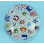 A Clichy millefiori chequer paperweight, cracked, a British garland paperweight on a blue ground and