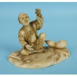 A Japanese ivory okimono of a seated man with a gourd and a bag, signed, red lacquer seal, 6cm